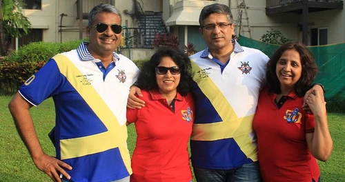 Reunion couples wearing cut and sew blue and white and red tailormade Polo shirts - Delivered in 
